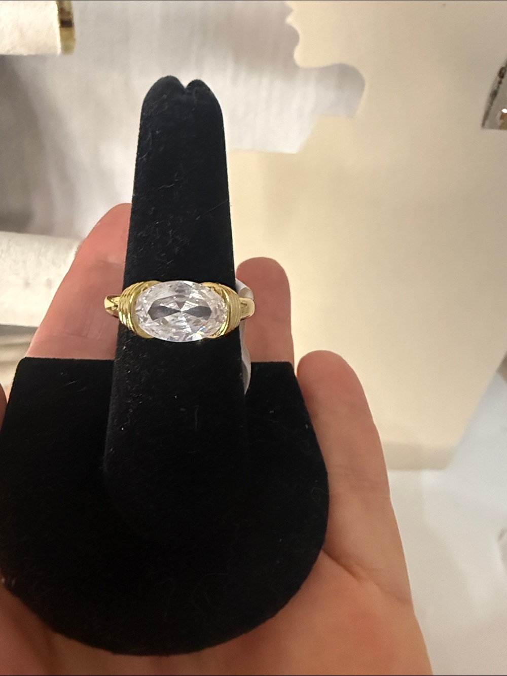 Gold Ring with Large East to West Clear Oval Stone